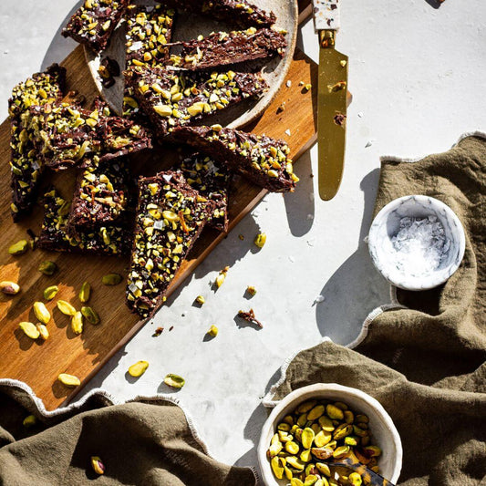 Dubai chocolate collagen bark on a board with pistachios