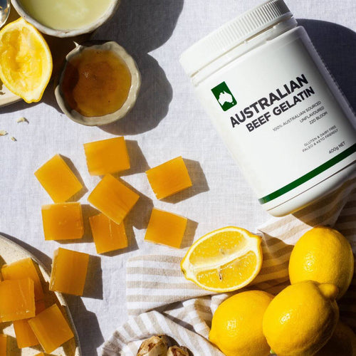 honey and ginger gummies on bench with Nutraviva gelatin tub