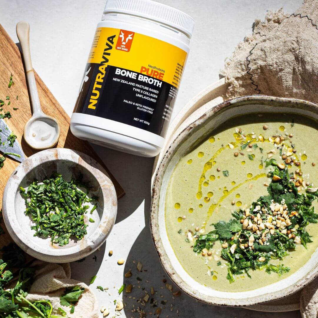 bone broth powder next to a bowl of soup with herbs
