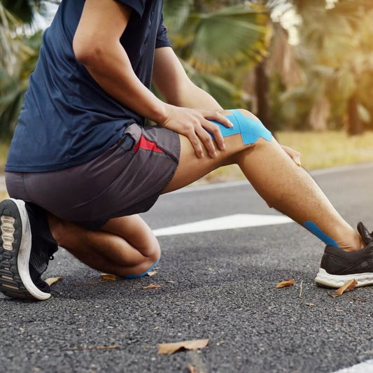 man holding knee after running