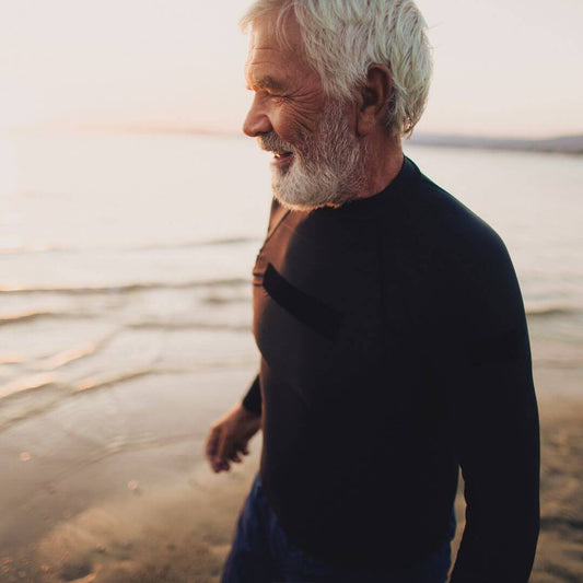 man on beach collagen bone health blog image